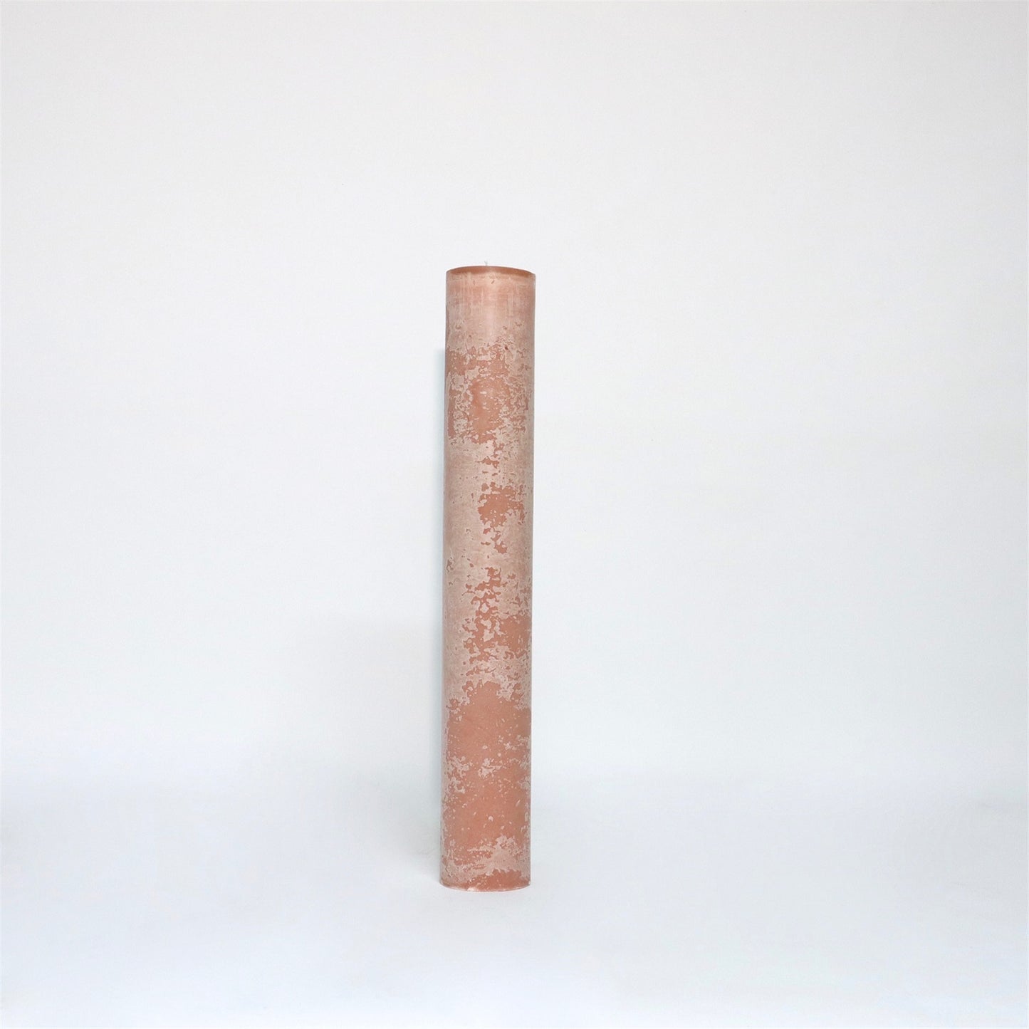 A tall, cylindrical, brique candle with a textured surface standing upright against a plain white background.