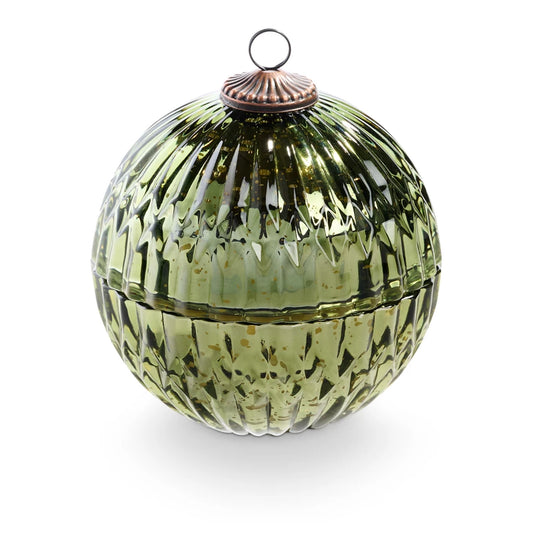 
A green glass ornament with textured detailing, a metal top loop, and a hidden candle inside, shown closed and open with the candle lit.