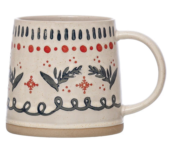 ceramic mug with festive, hand-painted designs featuring plants, patterns, and holiday-themed colors on a beige base.